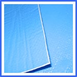 Close-up view of two blue pool covers partially covering a swimming pool, with sunlight reflecting off the water’s surface. | AES - Pool Heating & Energy Efficient Products